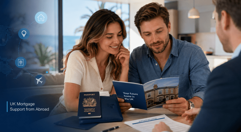 White couple reviewing UK property documents with an adviser while arranging a UK mortgage while living abroad.